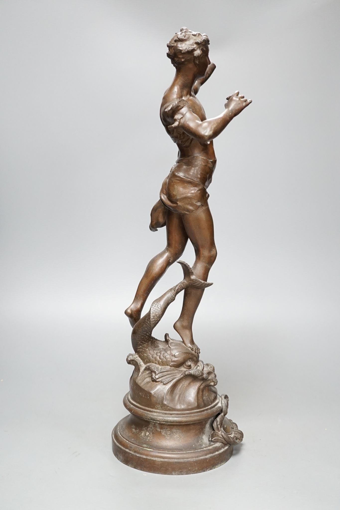 After Ferrand, a spelter figure of a gentleman upon a dolphin, plaque to base reading ‘Zephyr Marin Par Ferrand’, 50cm